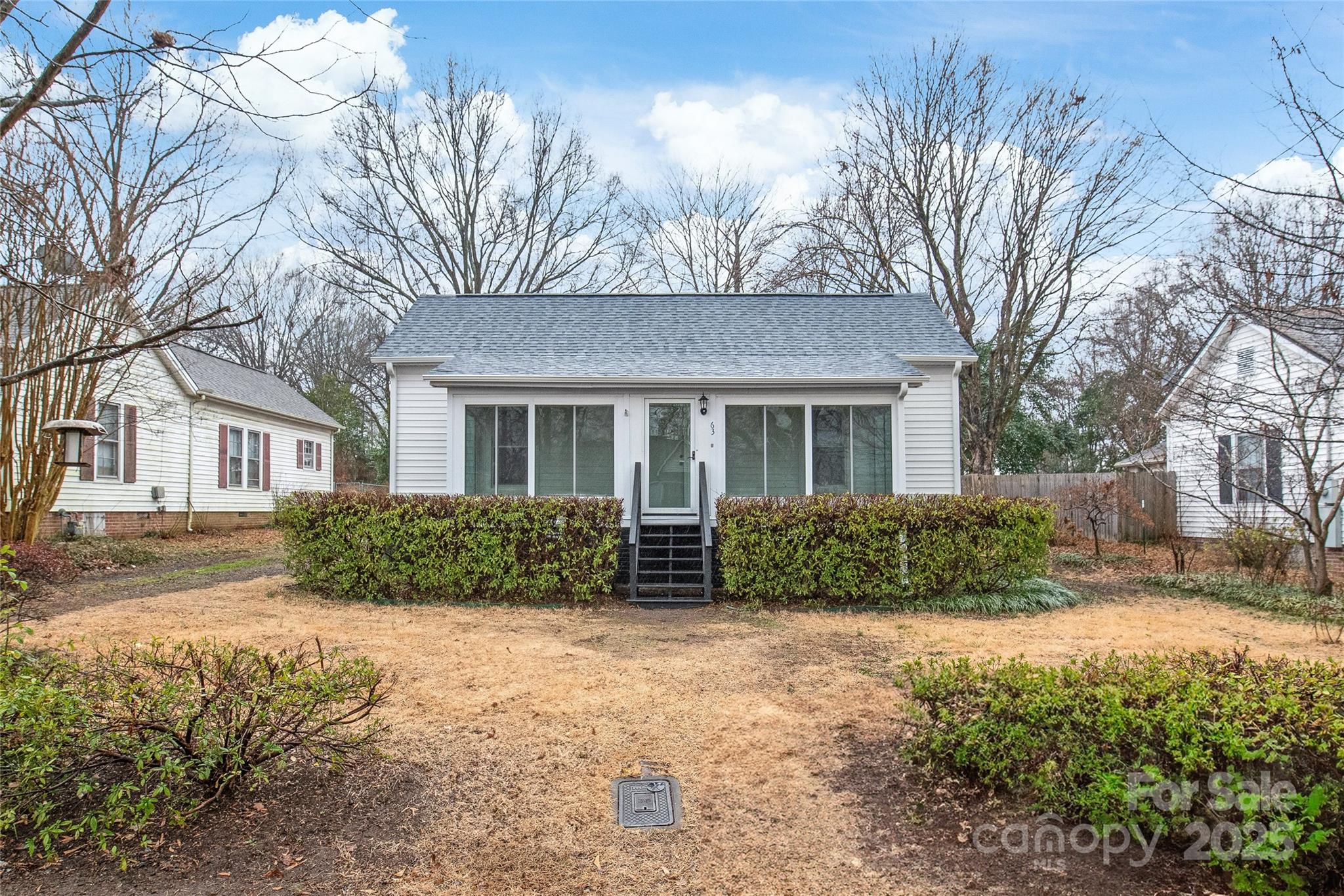 63 3rd Street Northwest Concord, NC 28027 - Photo 3 of 28 a front view of a house with a yard