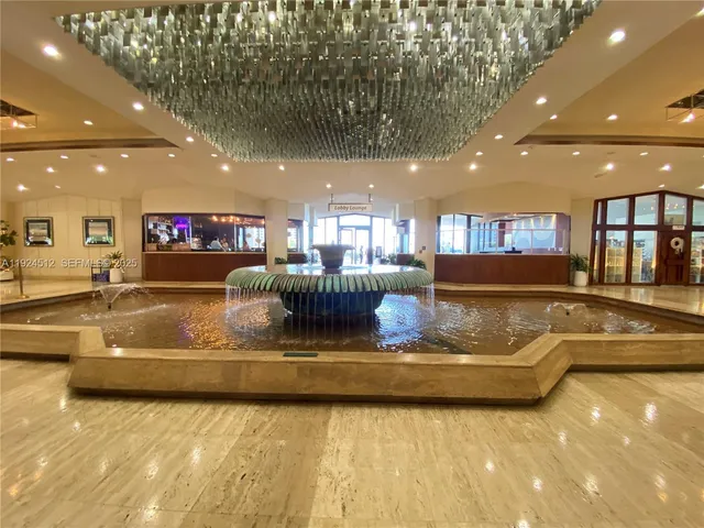 a view of a living room and kitchen with a large window