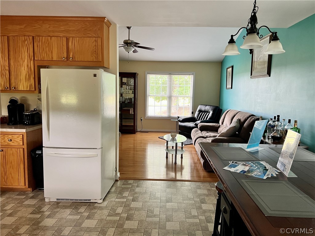 8428 Rowanty Road Carson, VA 23830 - Photo 9 of 22 a kitchen with a refrigerator and a stove top oven