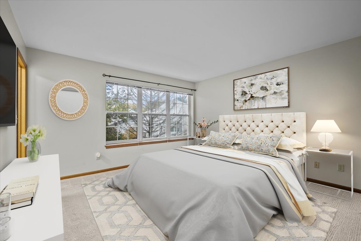 1215 Koster Court Geneva, IL 60134 - Photo 13 of 22 a bedroom with a large bed and a large window
