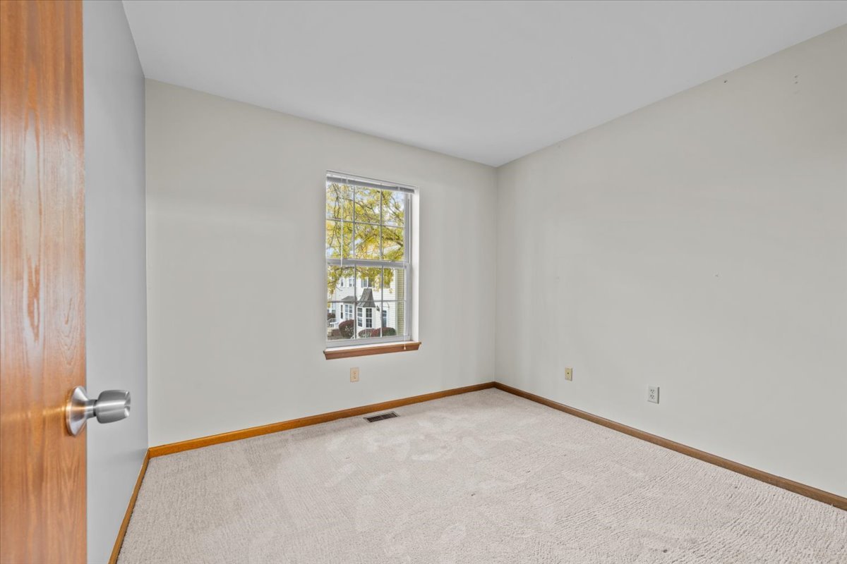 1215 Koster Court Geneva, IL 60134 - Photo 19 of 22 an empty room with a window