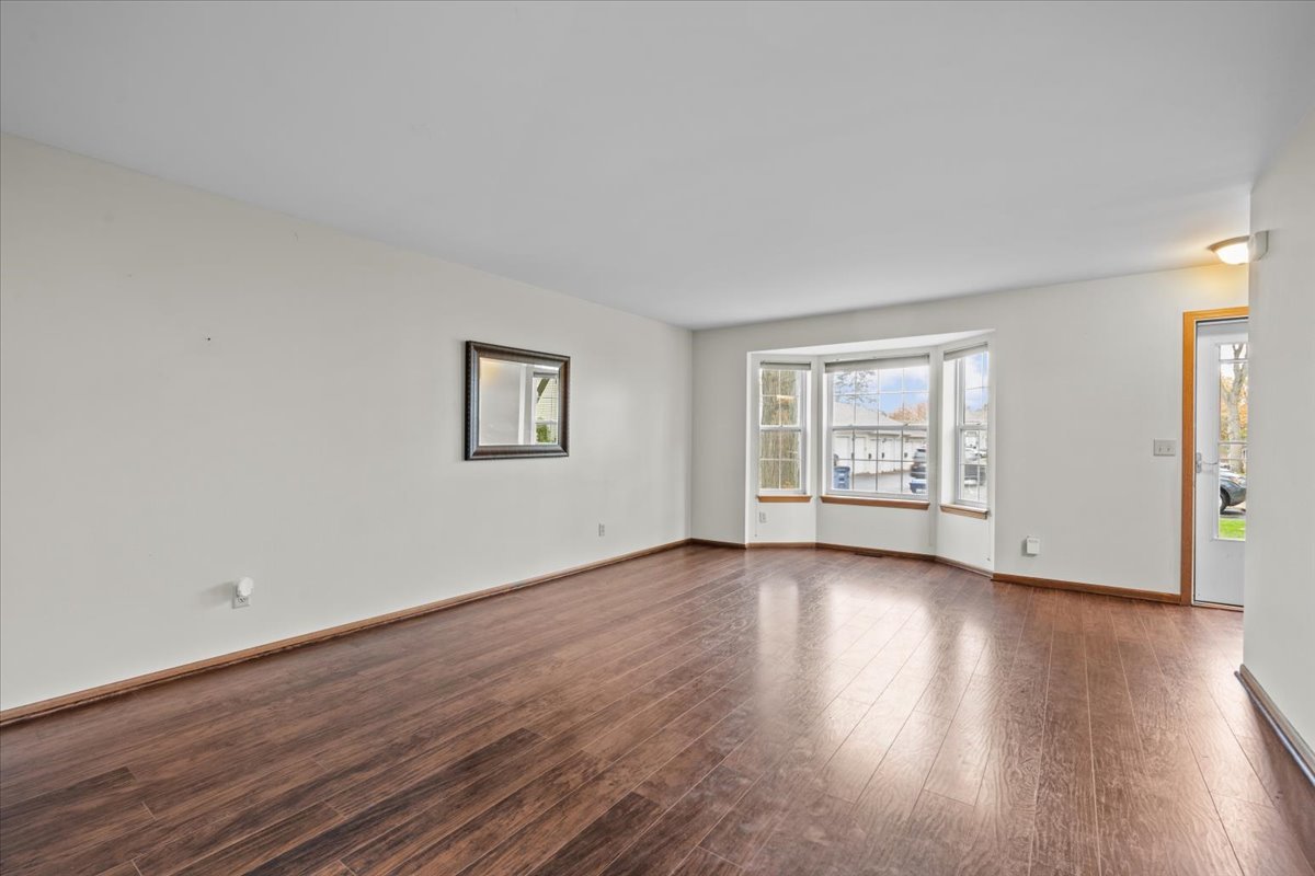 1215 Koster Court Geneva, IL 60134 - Photo 5 of 22 a view of a room with wooden floor and window