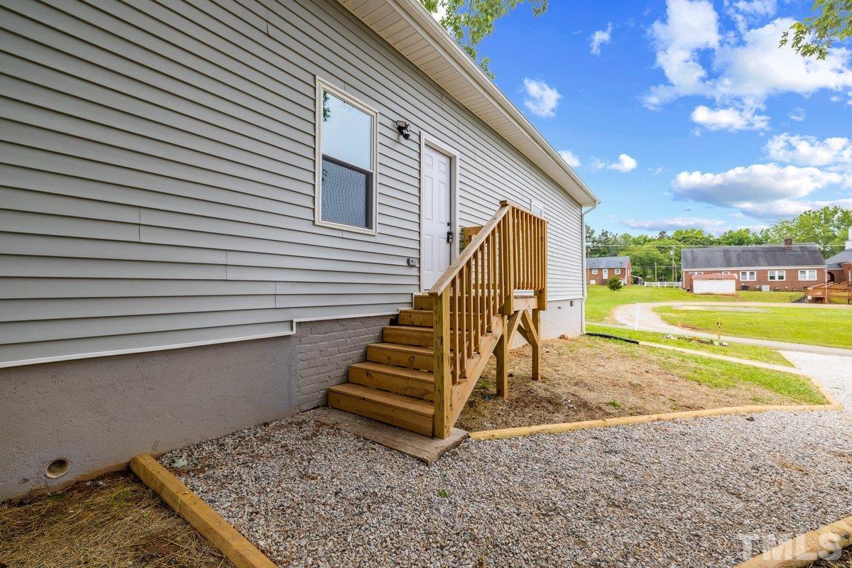 154 Summit Street Roxboro, NC 27573 - Photo 15 of 19 a view of a house with a yard