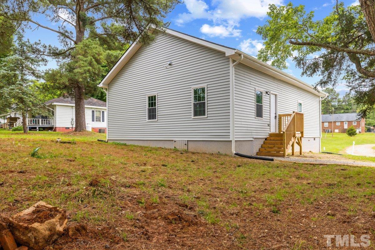 154 Summit Street Roxboro, NC 27573 - Photo 16 of 19 a view of a house with a yard