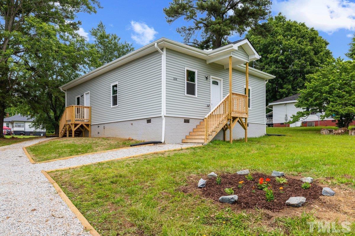 154 Summit Street Roxboro, NC 27573 - Photo 17 of 19 a view of a house with backyard