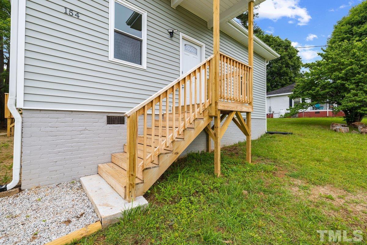154 Summit Street Roxboro, NC 27573 - Photo 18 of 19 a view of a house with a yard