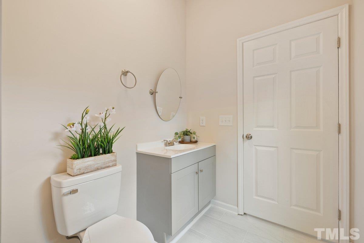 154 Summit Street Roxboro, NC 27573 - Photo 4 of 19 a bathroom with a sink a toilet and a shower