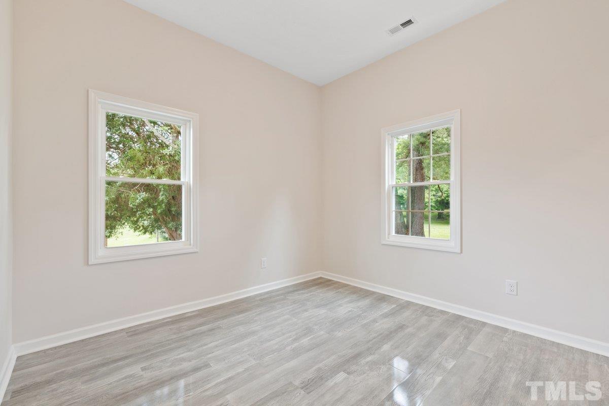 154 Summit Street Roxboro, NC 27573 - Photo 6 of 19 an empty room with a window