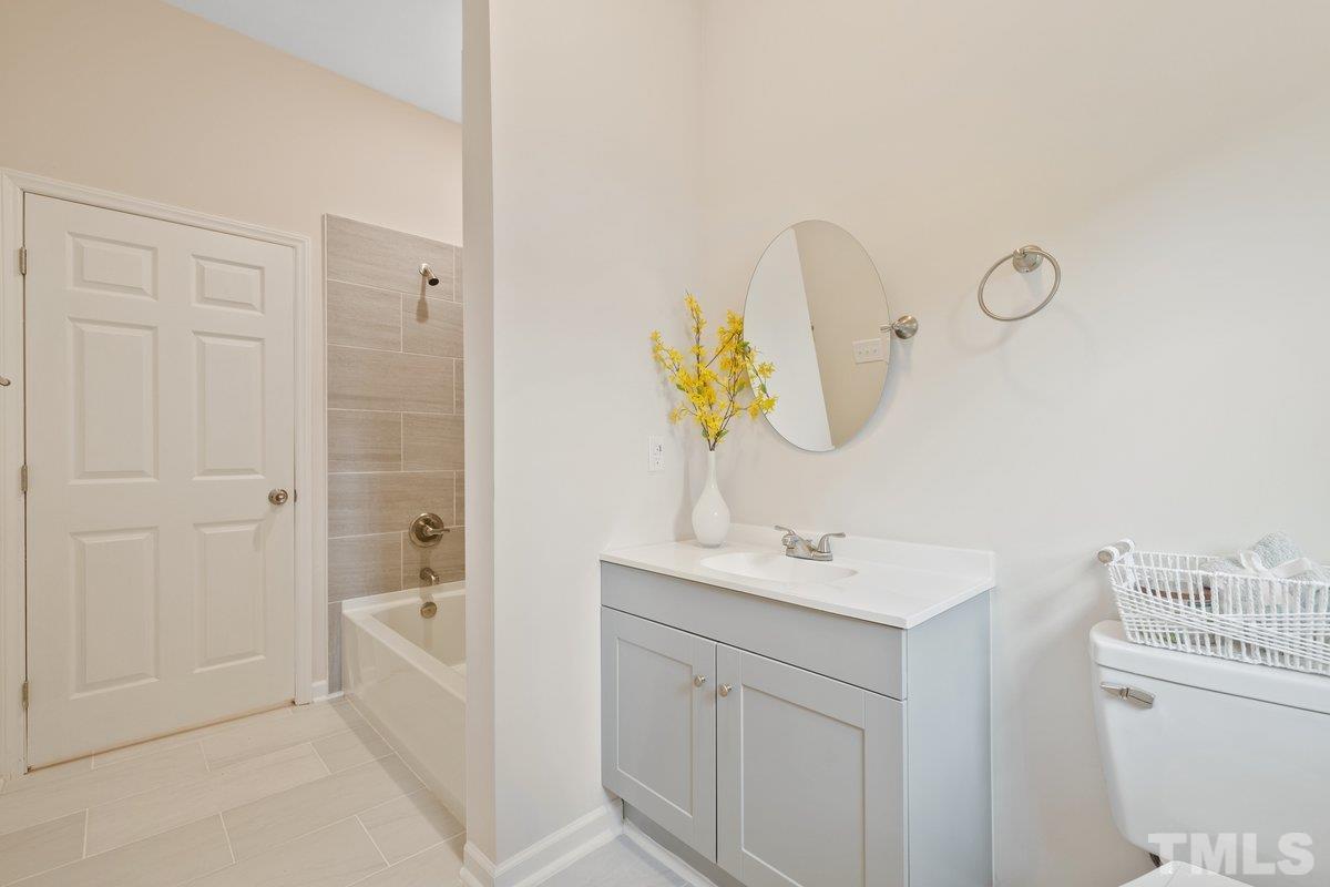 154 Summit Street Roxboro, NC 27573 - Photo 9 of 19 a bathroom with a sink and a mirror