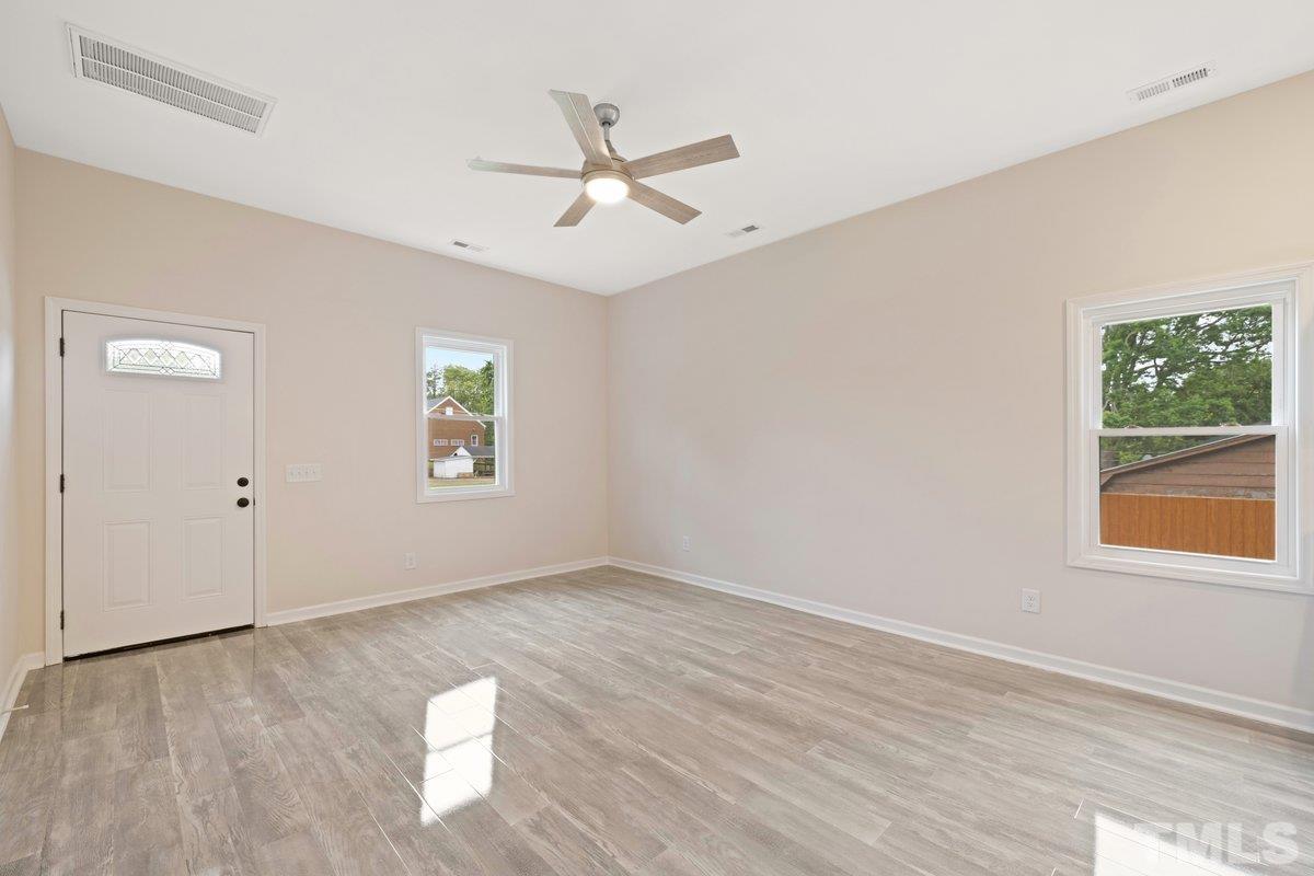 154 Summit Street Roxboro, NC 27573 - Photo 10 of 19 a view of an empty room with a window