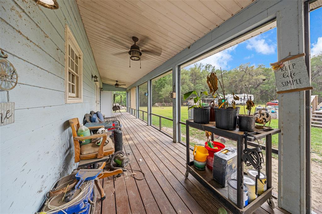 732 Carl Wilson Road Fort White, FL 32038 - Photo 37 of 80 a view of a chairs and table in a balcony