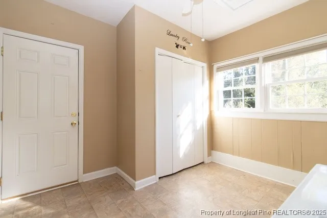 a view of an empty room with a window