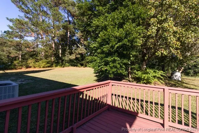 a view of a balcony with wooden fence