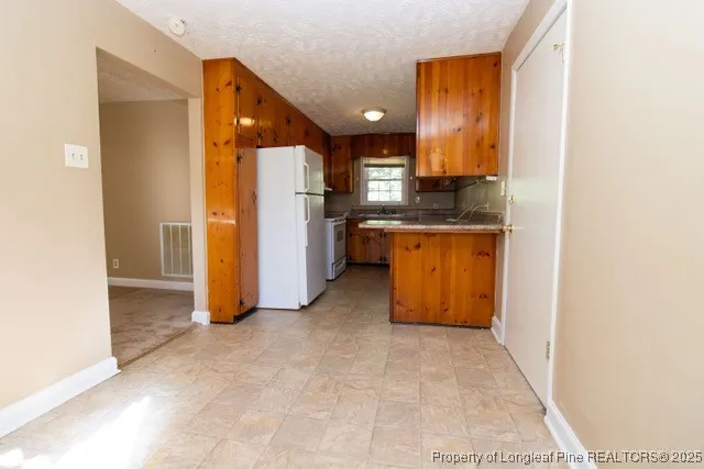 a view of a kitchen with a sink