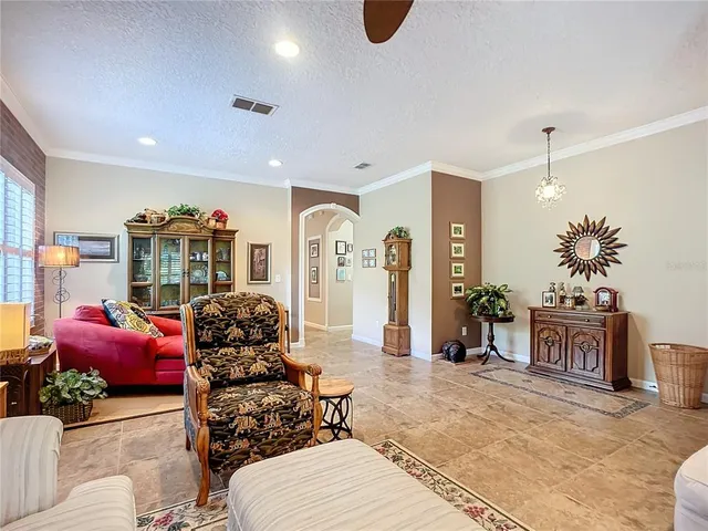 a kitchen with kitchen island granite countertop a refrigerator stove top oven and sink