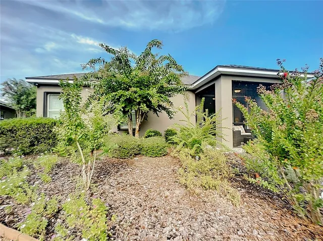 an aerial view of house with yard