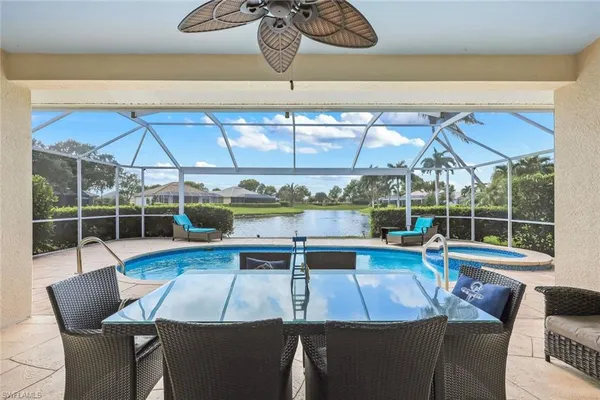 a view of a dining room with furniture window and outside view