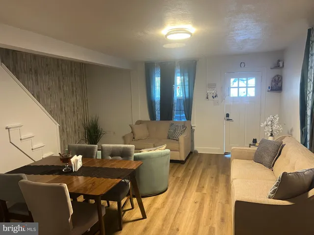 a living room with furniture and a table