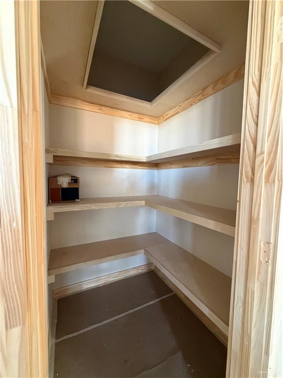 6107 West Street Edcouch, TX 78538 - Photo 17 of 27 a view of walk in closet with empty racks