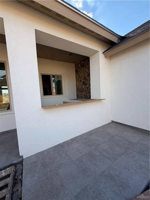 6107 West Street Edcouch, TX 78538 - Photo 2 of 27 a view of an empty room with wooden floor and a window