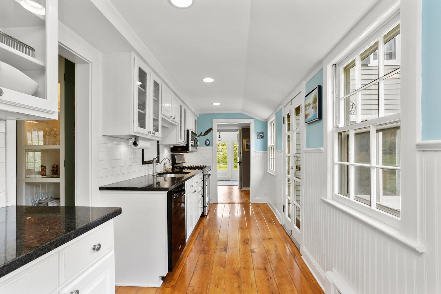 31 Jelliff Mill Road New Canaan, CT 06840 - Photo 12 of 51 a kitchen with stainless steel appliances granite countertop a refrigerator a stove and a wooden floors
