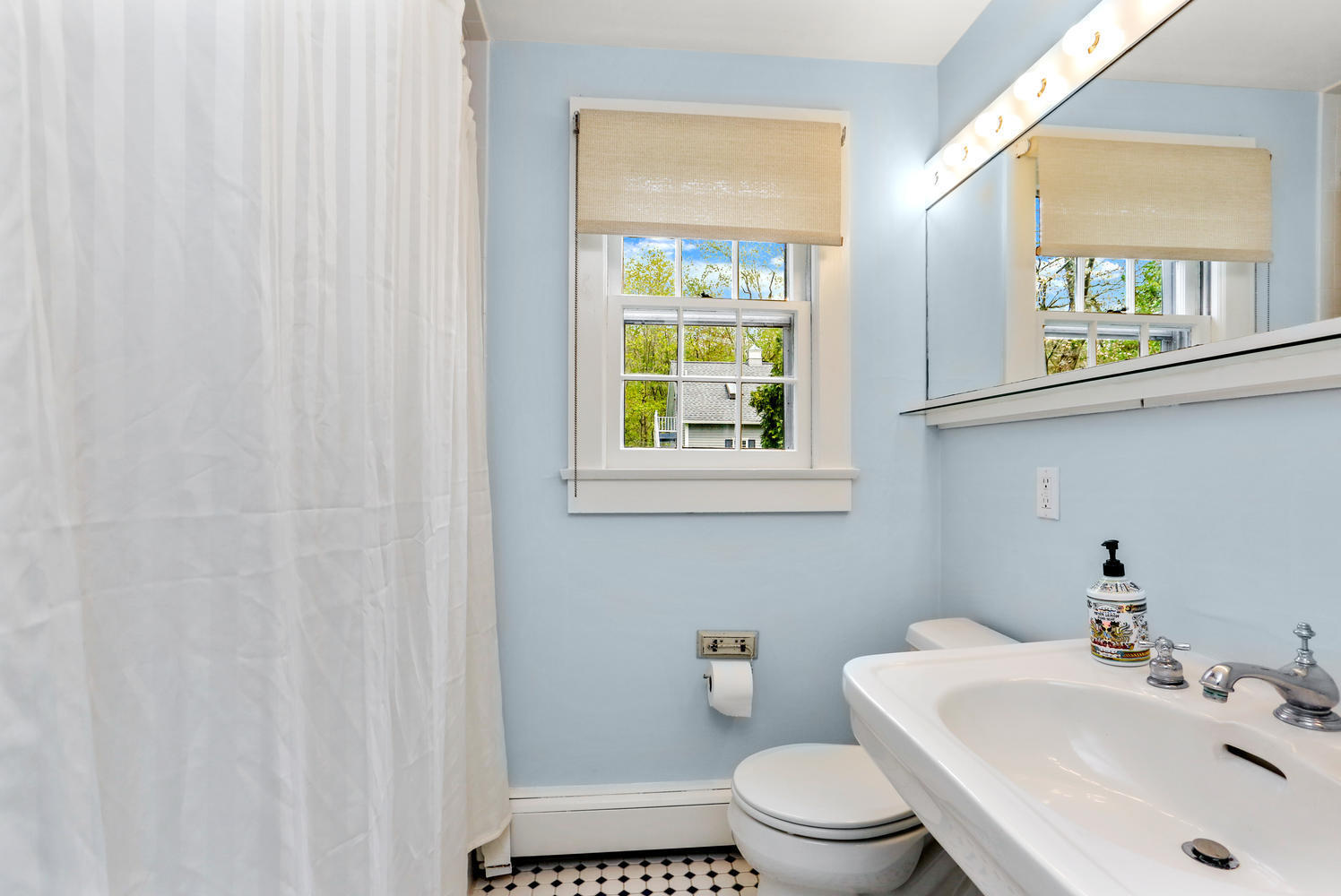 31 Jelliff Mill Road New Canaan, CT 06840 - Photo 15 of 51 a bathroom with a sink a toilet and a mirror