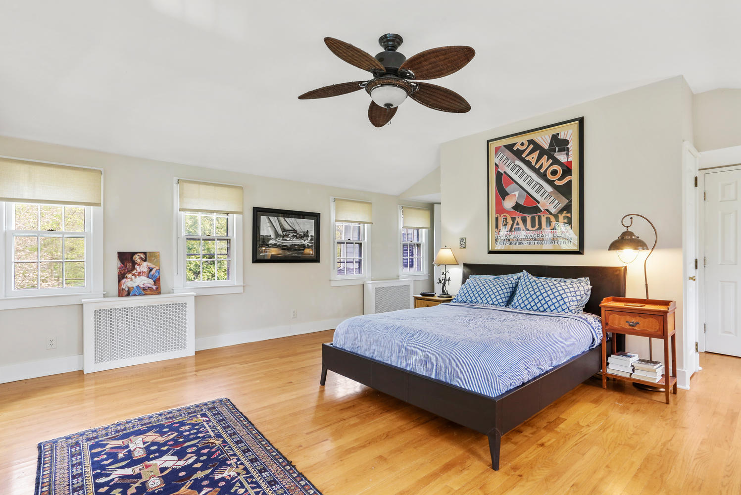 31 Jelliff Mill Road New Canaan, CT 06840 - Photo 20 of 51 a bedroom with a bed and dresser with wooden floor