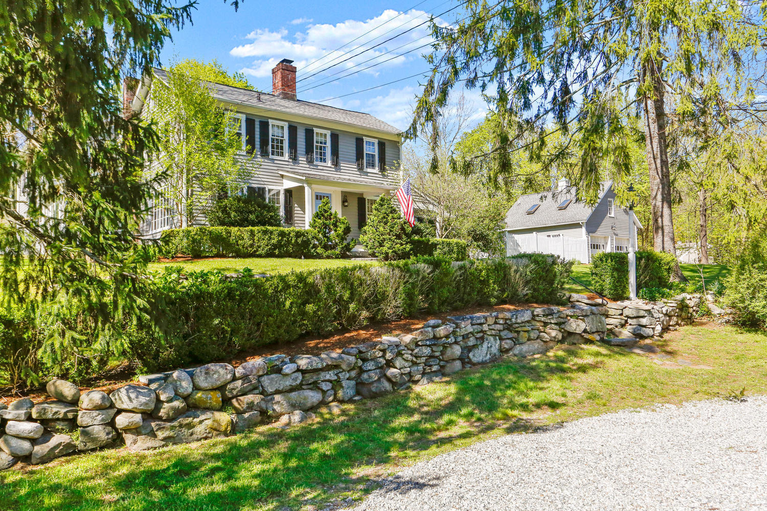 31 Jelliff Mill Road New Canaan, CT 06840 - Photo 2 of 51 a front view of a house with a yard
