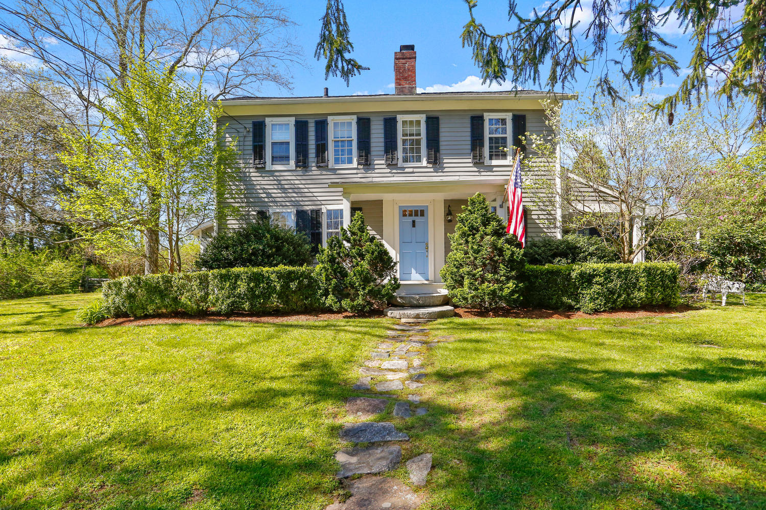 31 Jelliff Mill Road New Canaan, CT 06840 - Photo 3 of 51 a front view of a house with a yard