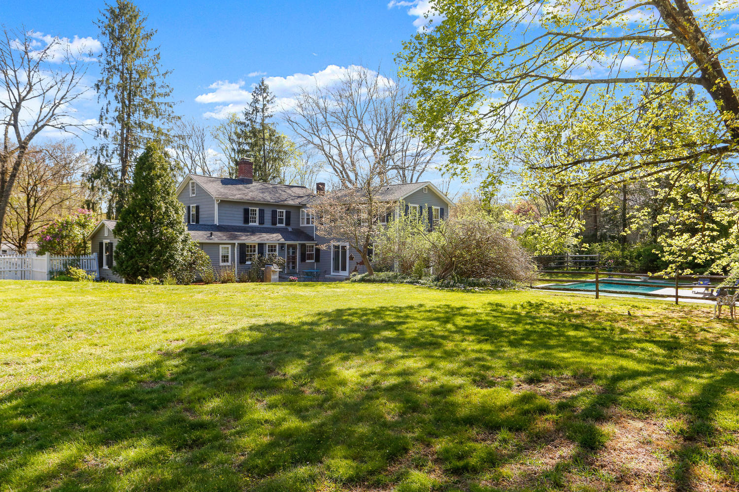 31 Jelliff Mill Road New Canaan, CT 06840 - Photo 47 of 51 a view of a swimming pool with an outdoor space and seating area