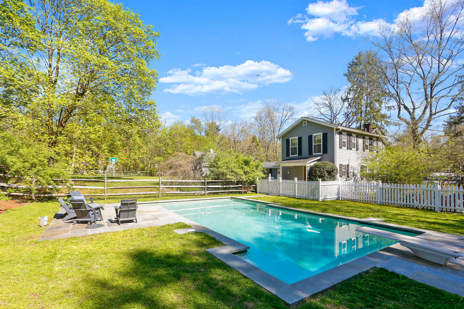 31 Jelliff Mill Road New Canaan, CT 06840 - Photo 5 of 51 a view of an house with swimming pool and sitting area