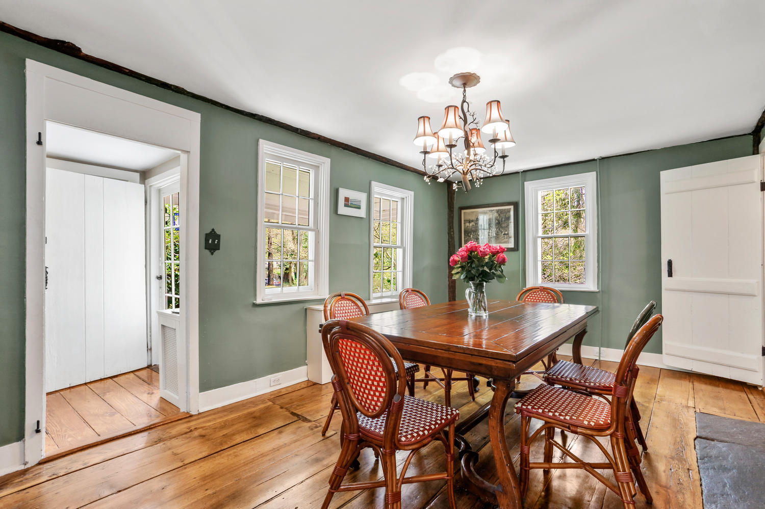 31 Jelliff Mill Road New Canaan, CT 06840 - Photo 10 of 51 a dining room with furniture a chandelier and wooden floor