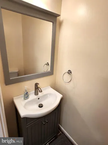 a bathroom with a sink and mirror