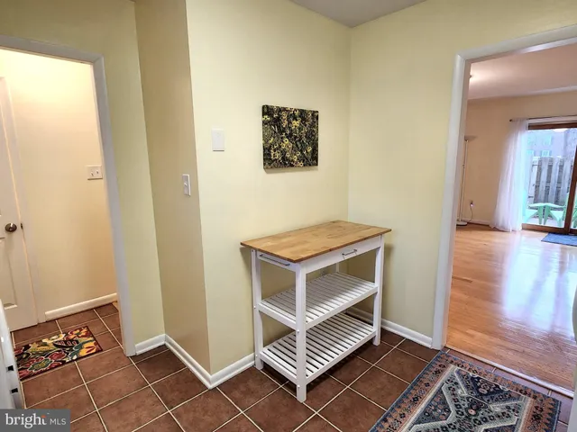 a living room with a piano and a stove
