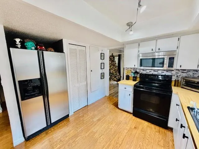a bedroom with a bed dresser and a window