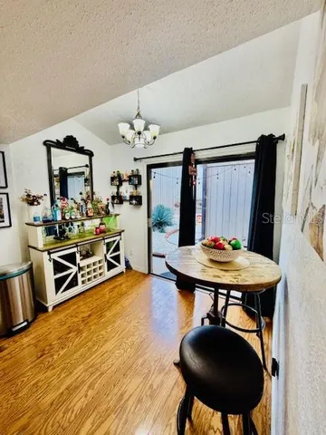 a living room with furniture and a dresser
