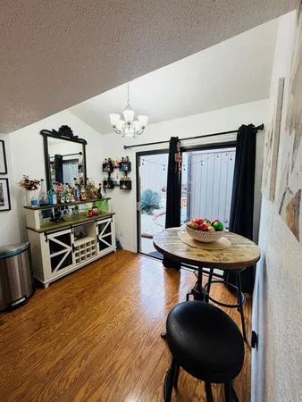 a bedroom with a bed dresser and a window