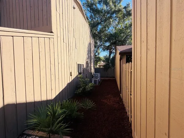a bedroom with furniture and a wooden floor