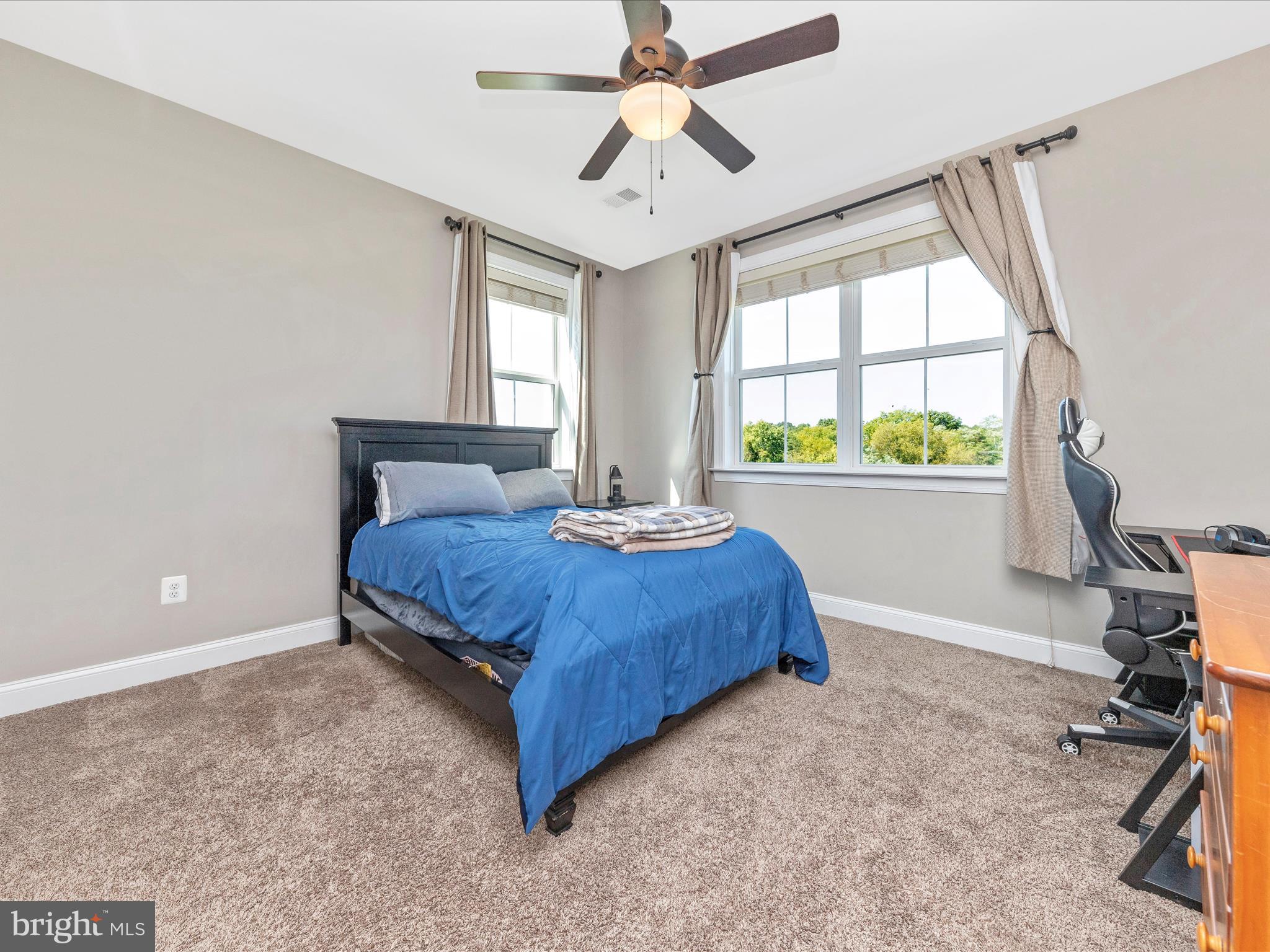 14671 Sugarland Road Poolesville, MD 20837 - Photo 31 of 62 a bedroom with a bed and window