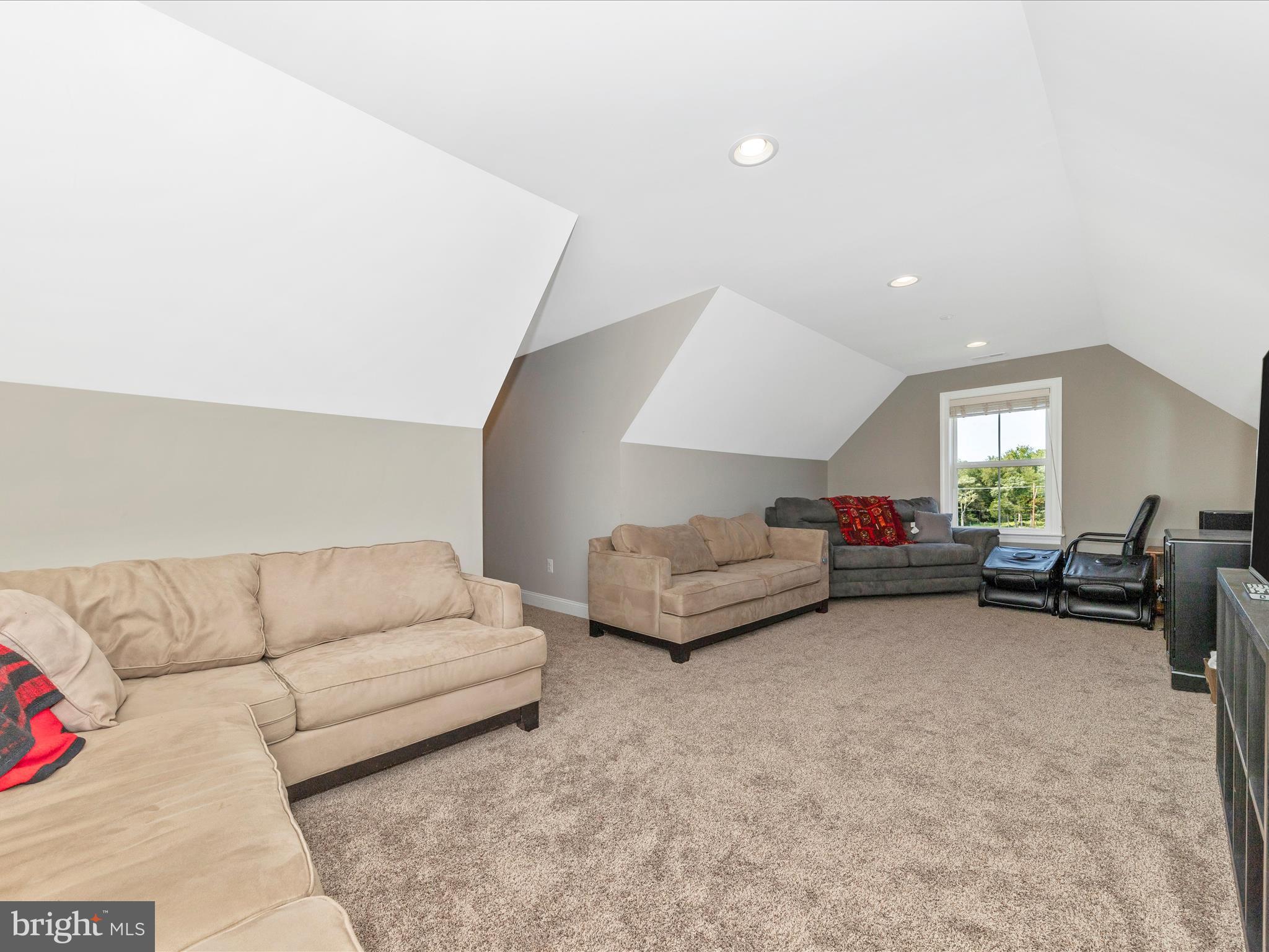 14671 Sugarland Road Poolesville, MD 20837 - Photo 40 of 62 a living room with furniture and a couch