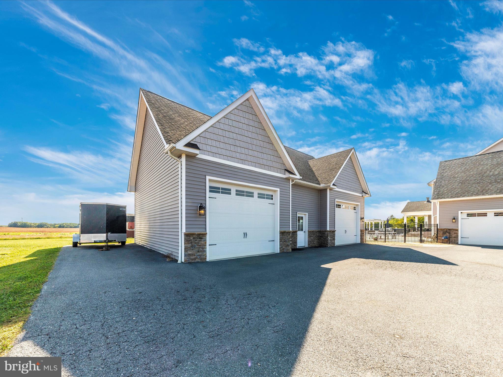 14671 Sugarland Road Poolesville, MD 20837 - Photo 43 of 62 a view of a house with a patio
