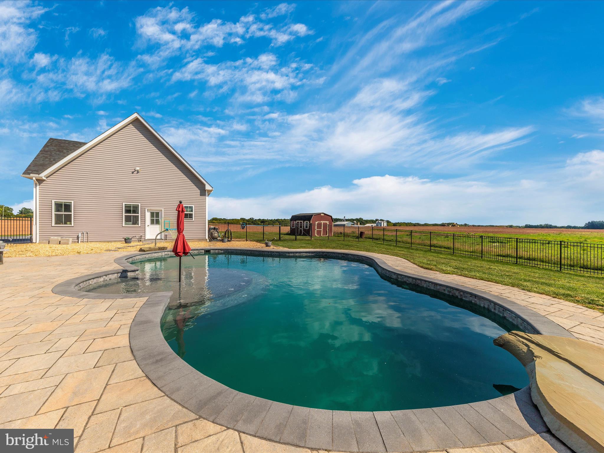 14671 Sugarland Road Poolesville, MD 20837 - Photo 53 of 62 a view of a swimming pool with a yard