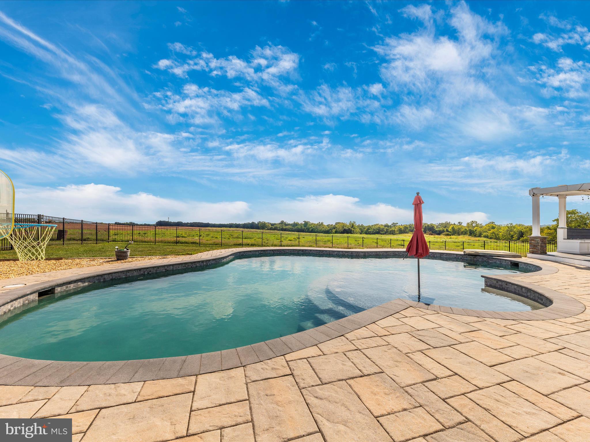 14671 Sugarland Road Poolesville, MD 20837 - Photo 54 of 62 a view of a swimming pool and an outdoor seating