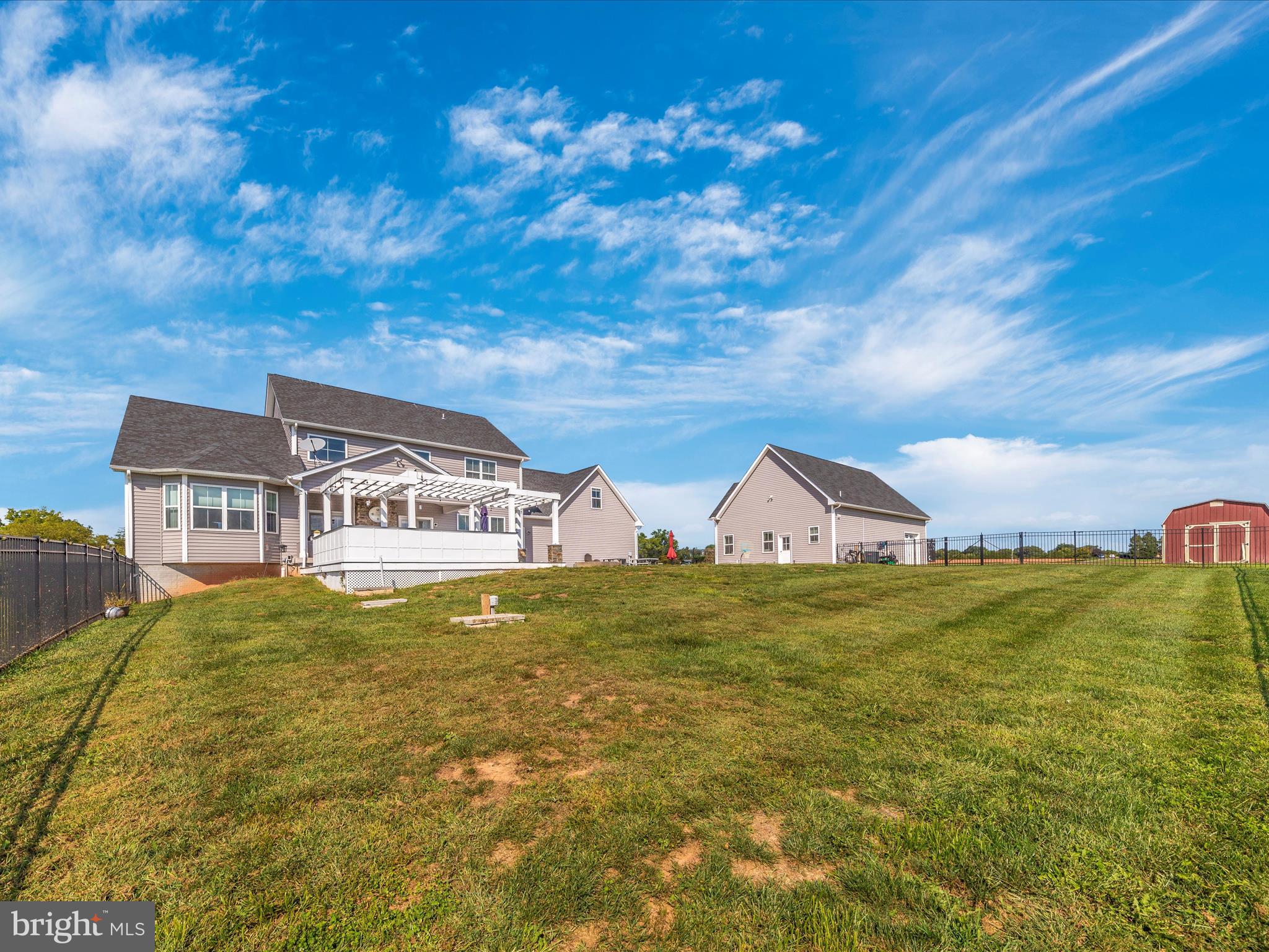14671 Sugarland Road Poolesville, MD 20837 - Photo 58 of 62 a front view of a house with garden