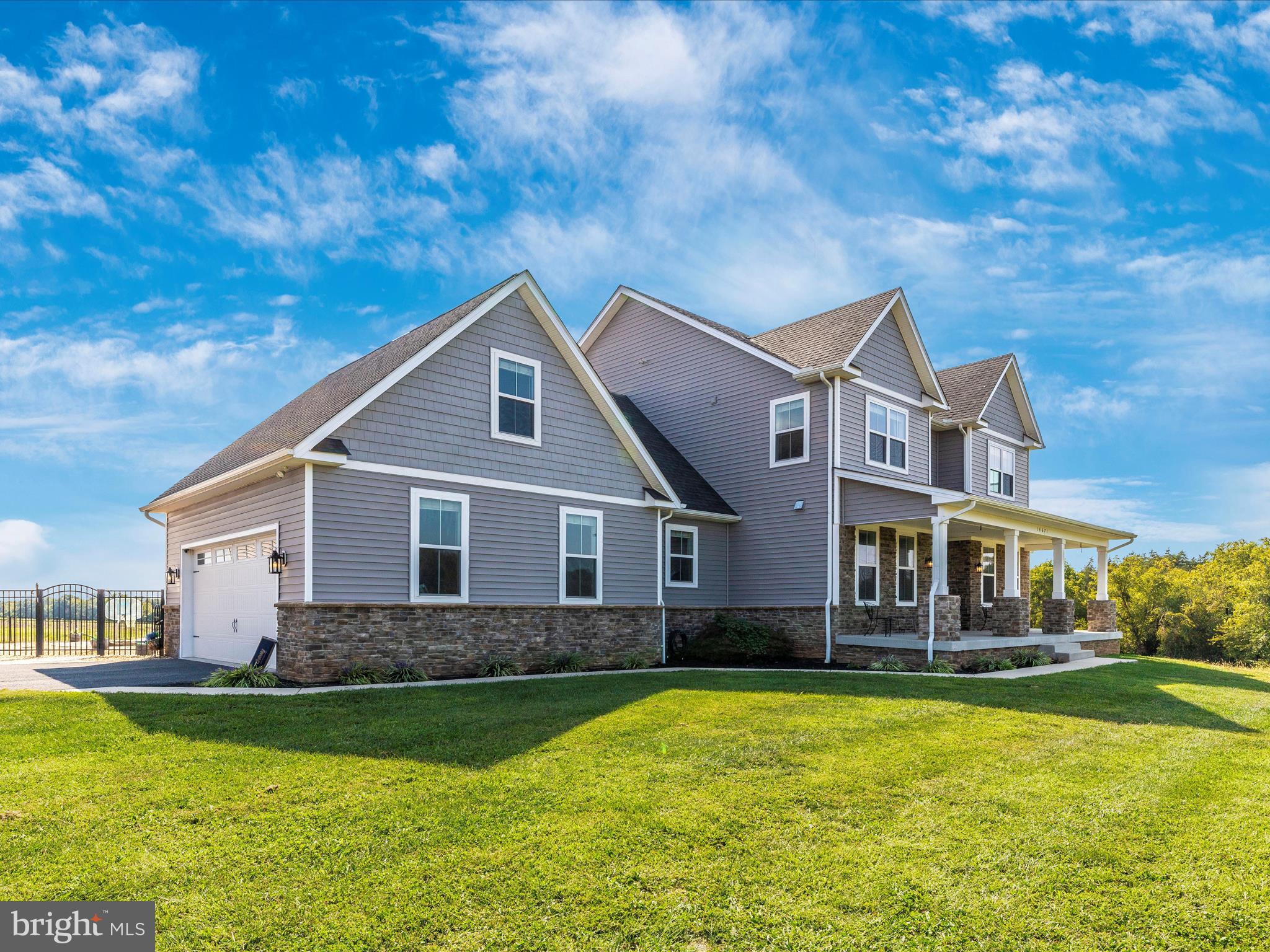 14671 Sugarland Road Poolesville, MD 20837 - Photo 62 of 62 a front view of a house with a yard