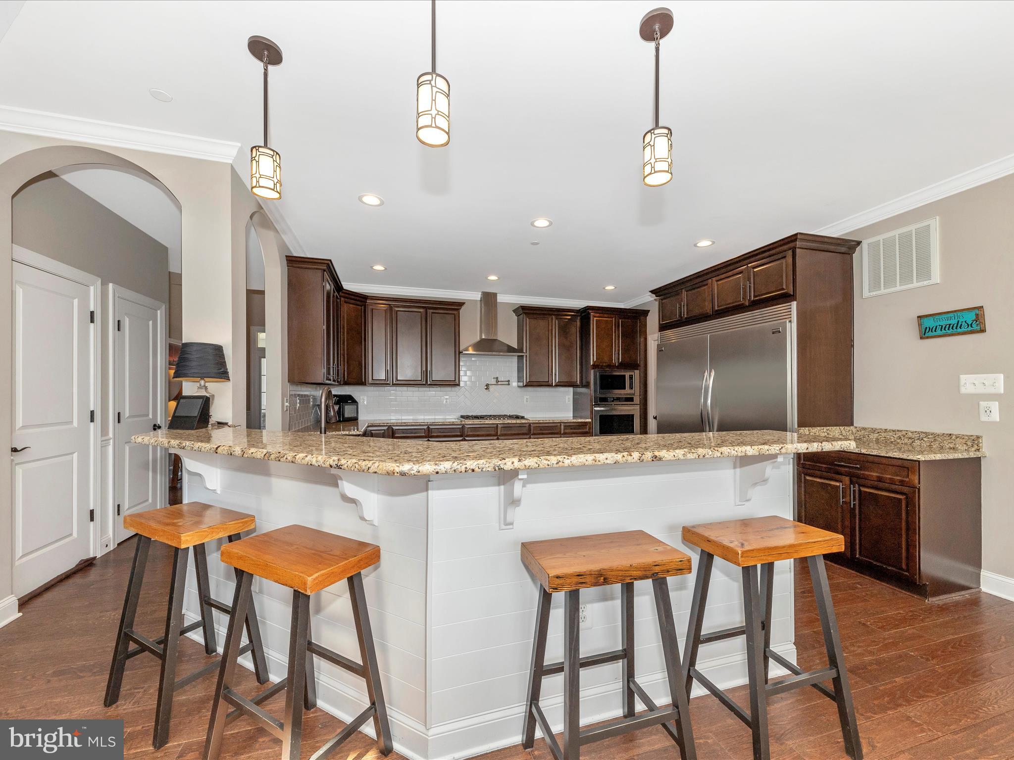 14671 Sugarland Road Poolesville, MD 20837 - Photo 7 of 62 a large kitchen with a table and chairs