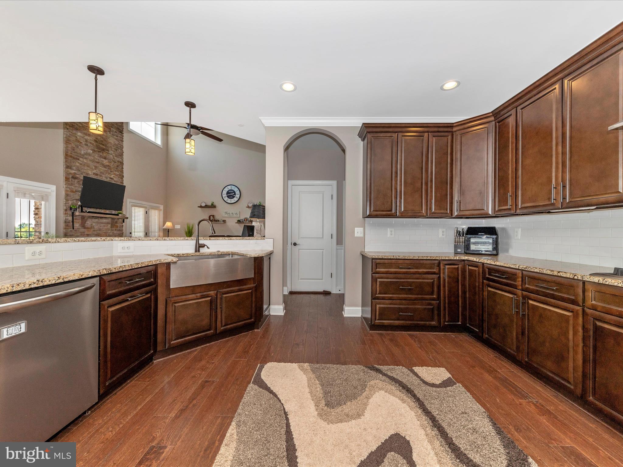 14671 Sugarland Road Poolesville, MD 20837 - Photo 10 of 62 a kitchen with stainless steel appliances granite countertop a sink stove and cabinets
