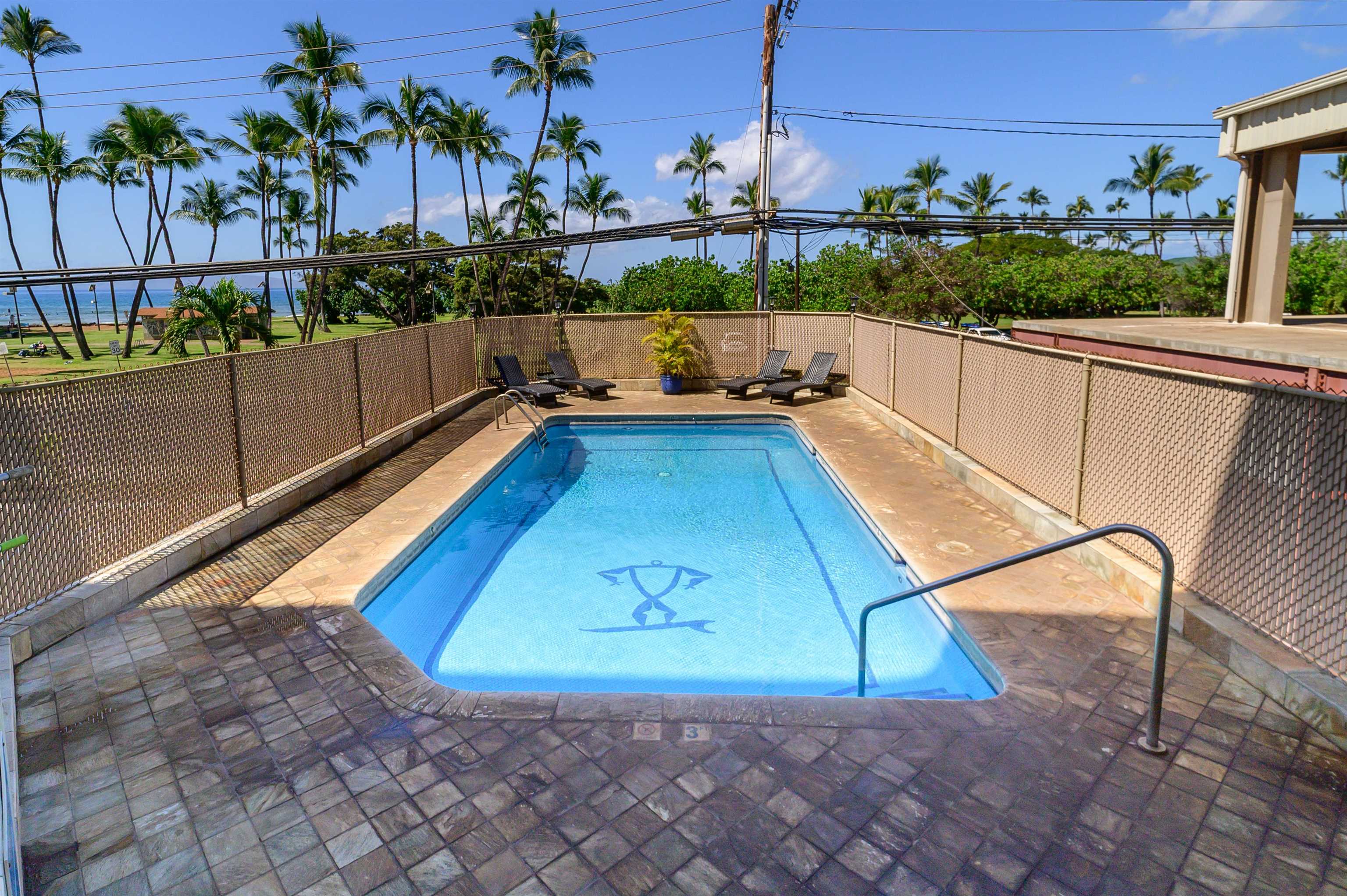 1993 South Kihei Road, Unit 201 Kihei, HI 96753 - Photo 11 of 11 a view of a swimming pool with a chairs in front of it