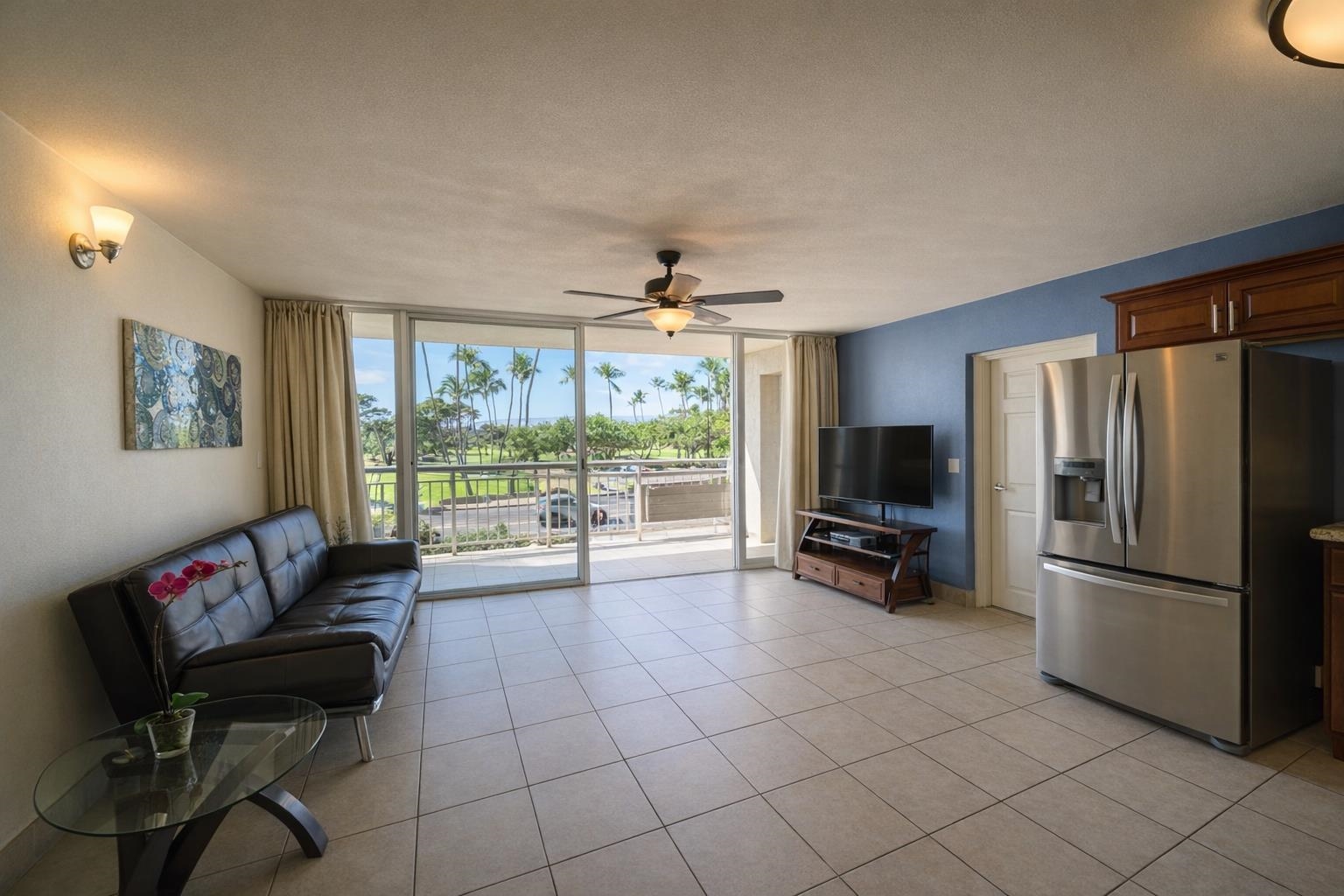 1993 South Kihei Road, Unit 201 Kihei, HI 96753 - Photo 3 of 11 a living room with furniture and a flat screen tv