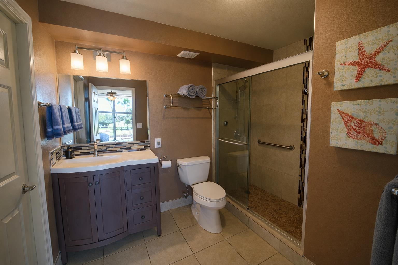 1993 South Kihei Road, Unit 201 Kihei, HI 96753 - Photo 5 of 11 a bathroom with a toilet sink and mirror